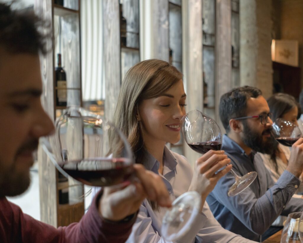 Group of people tasting wine at a cellar