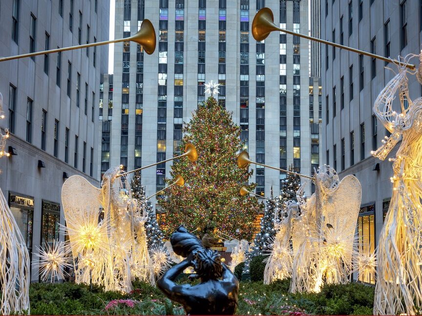 Famous Christmas Decoration with Angels and Christmas Tree, NYC (Angels blowing their horns and the Rockefeller Center Christmas tree in New York)